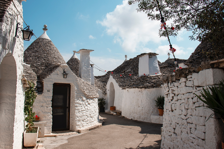 white honey-stoned balcony houses in the italian city of bari