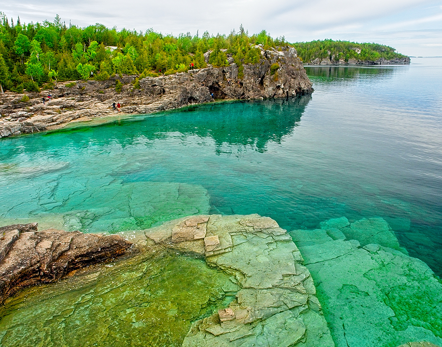 Shoreline view of Lake Huron with emerald green and blue clean water