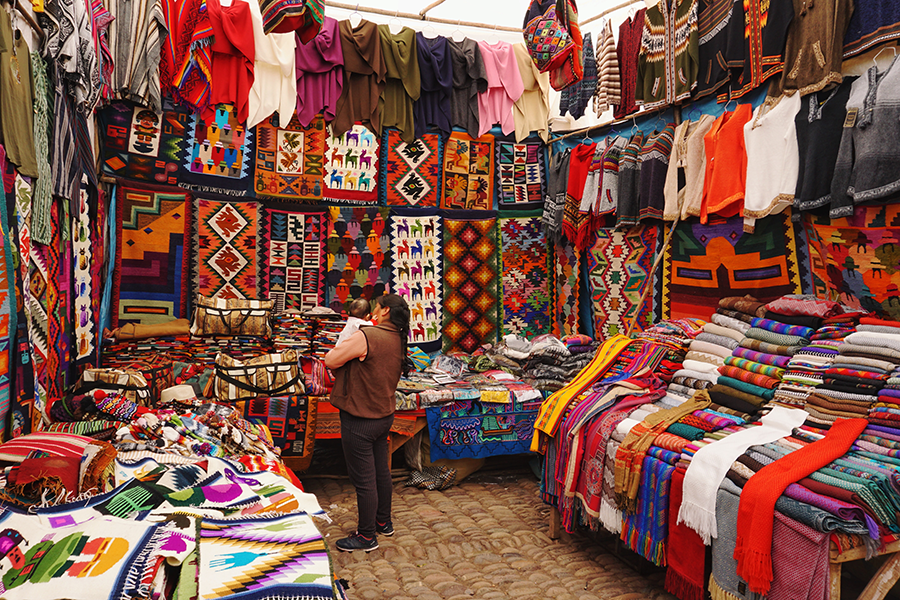 old town cusco shop with traditional peruvian tapestries