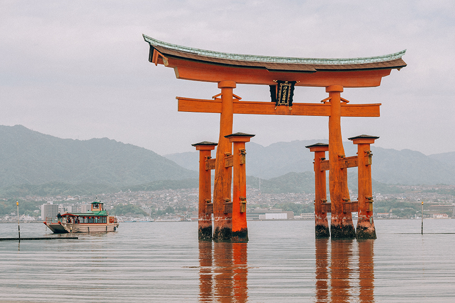 red Torii gates float on the water