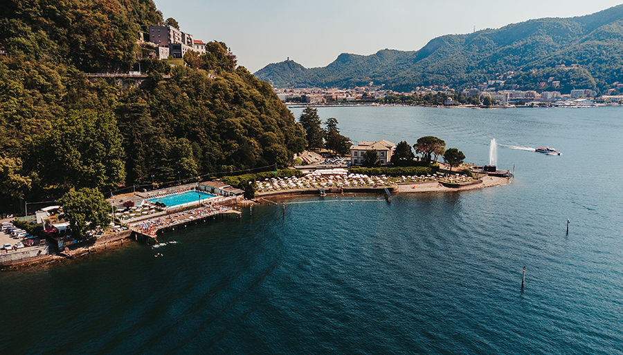 lake como shoreline with pool and lounging area